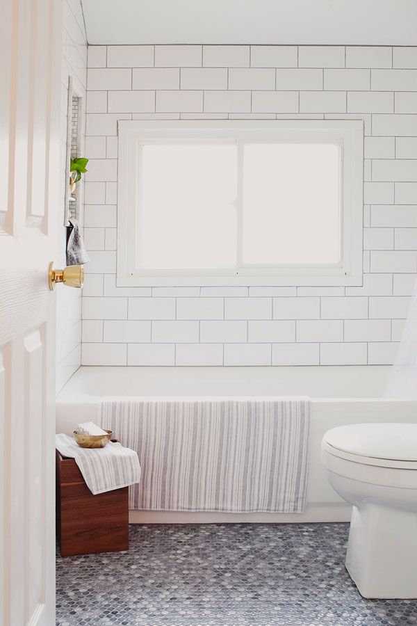 Mosaic bathroom floor from penny tiles