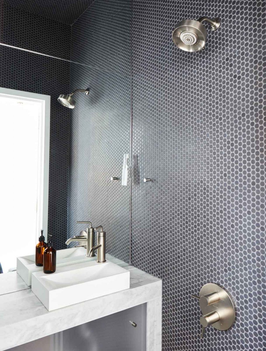 clad in savoy penny tile by ann sacks helped optimize the homes petite footprint 페니타일 penny tiles