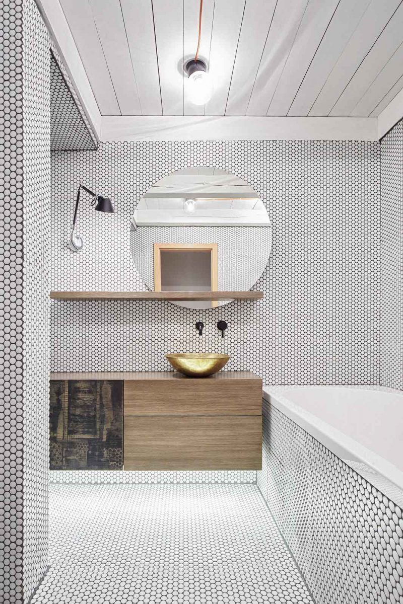 tolomeo micro parete lamp from artemide and brass washbasin from morocco in prague bathroom 페니타일 penny tiles
