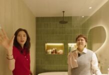 손담비가 올리브 그린 타일 욕실에서 인테리어를 소개하는 모습