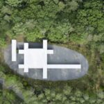 타원형 자갈 마당 위 Culvert Guesthouse를 바로 위에서 내려다본 항공 사진